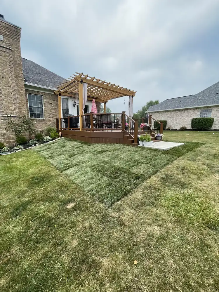 The same backyard area after new sod installation by J’s Design